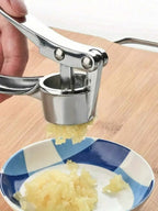 1 alloy garlic and ginger press, designed to crush garlic and ginger into a paste. Ideal for food preparation in home kitchens, making condiments in restaurant kitchens, and other uses.