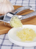 1 alloy garlic and ginger press, designed to crush garlic and ginger into a paste. Ideal for food preparation in home kitchens, making condiments in restaurant kitchens, and other uses.